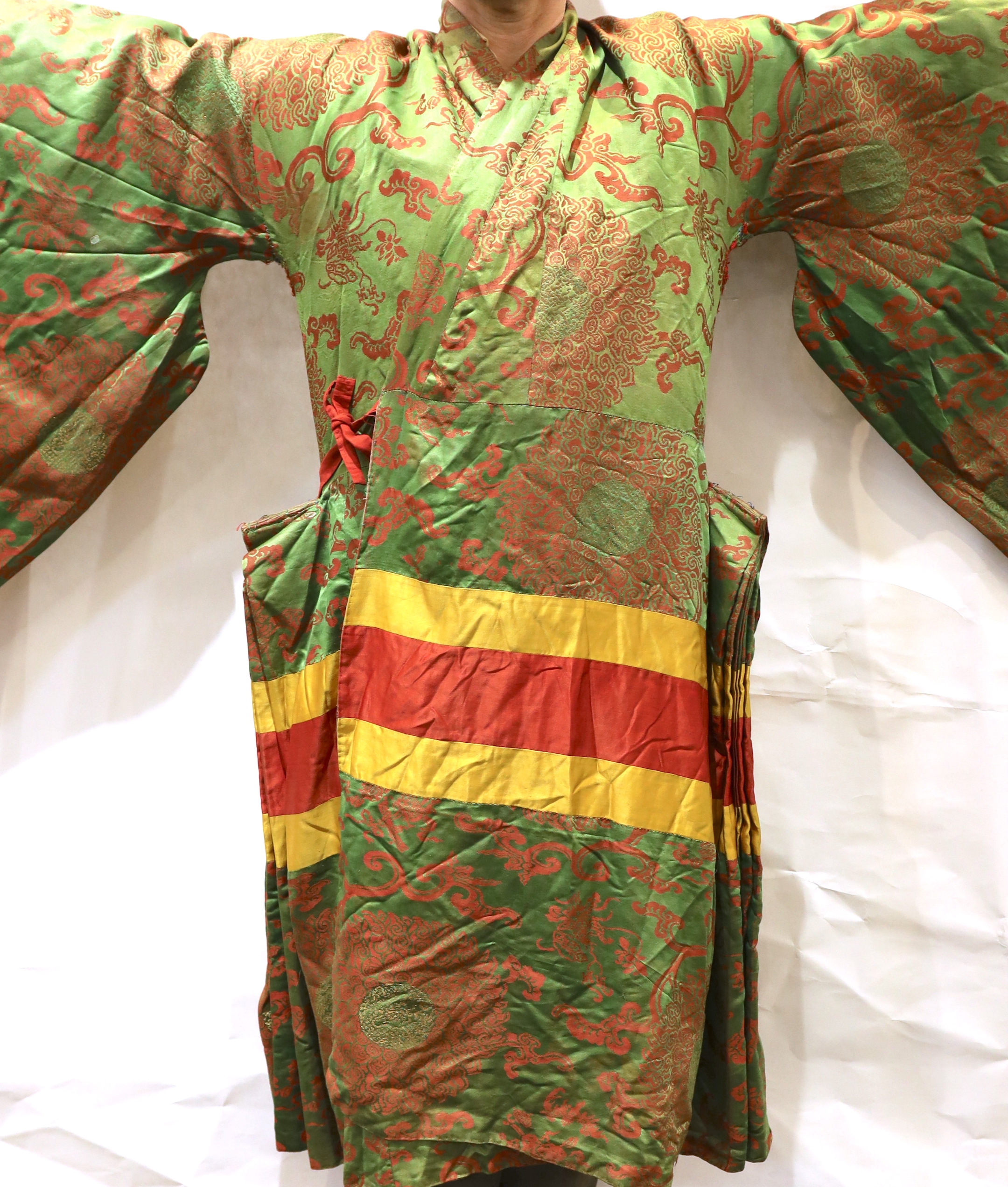 An unusual early 20th century Japanese silk damask kimono, designed with pointed sleeves and wide pleating on the hips, and horizontal yellow and red stripes, possibly a costume for a Kabuki theatre character